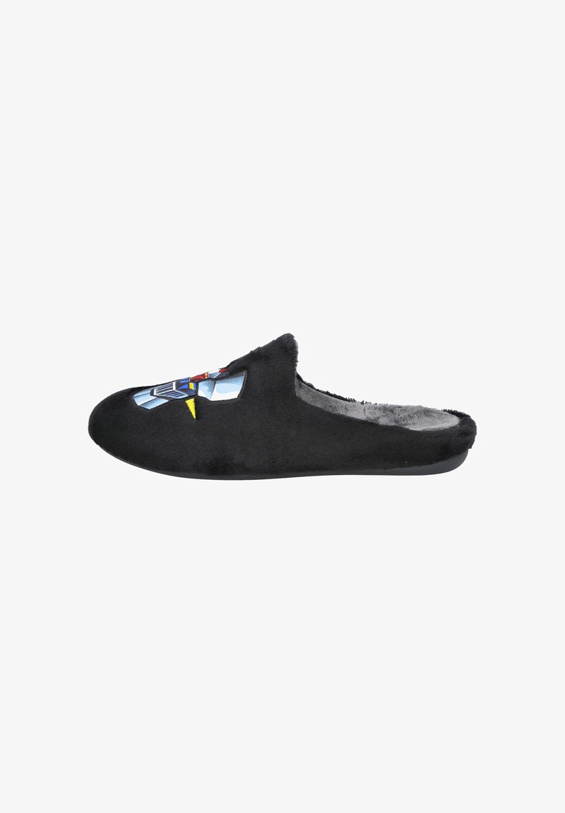 Zapatilla negra tipo slip-on de felpa que presenta una textura suave y un diseño gráfico colorido en la parte superior. Suela plana con forma de punta redondeada.