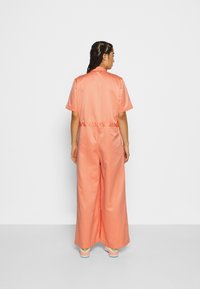 Jordan HERITAGE FLIGHTSUIT - Macacão - crimson bliss