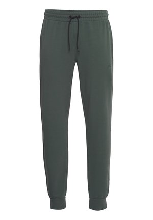 Pantalons de sport vert foncé en tissu doux, dotés d'une taille élastique avec un cordon de serrage ajustable et des ourlets resserrés.