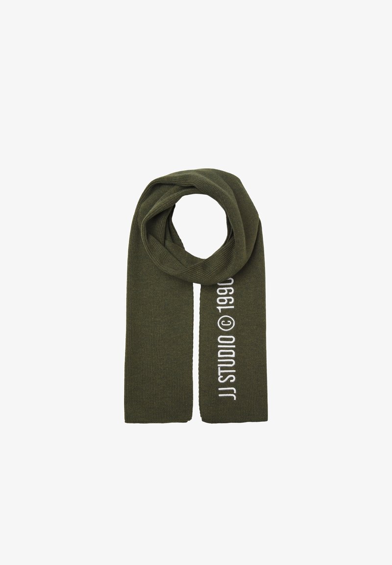 Olive green knit scarf with ribbed texture, featuring white text "JJ STUDIO © 1990" along one edge. Designed for warmth and comfort.