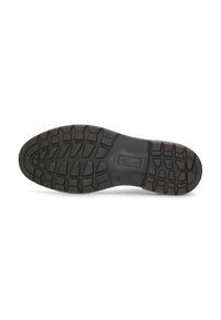 Suela de zapato de goma negra con un diseño de banda de rodadura con ranuras profundas para tracción y un diseño de tacón plano.