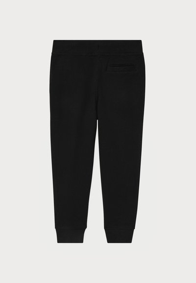 Pantalons de jogging noirs en tissu doux. Comprend une taille et des poignets ajustés, avec une poche à l'arrière pour le rangement. Texture lisse.