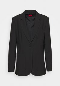 Černý blazer se strukturovaným designem, zapínání na jeden knoflík, dvě přední kapsy a klopový límeček. Vyrobeno z hladké látky.