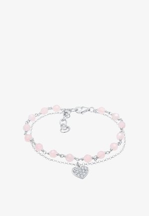 Bracelet en perles de quartz rose avec chaînes en argent, présentant un charm en forme de cœur orné d'accents scintillants. Clasp ajustable inclus.