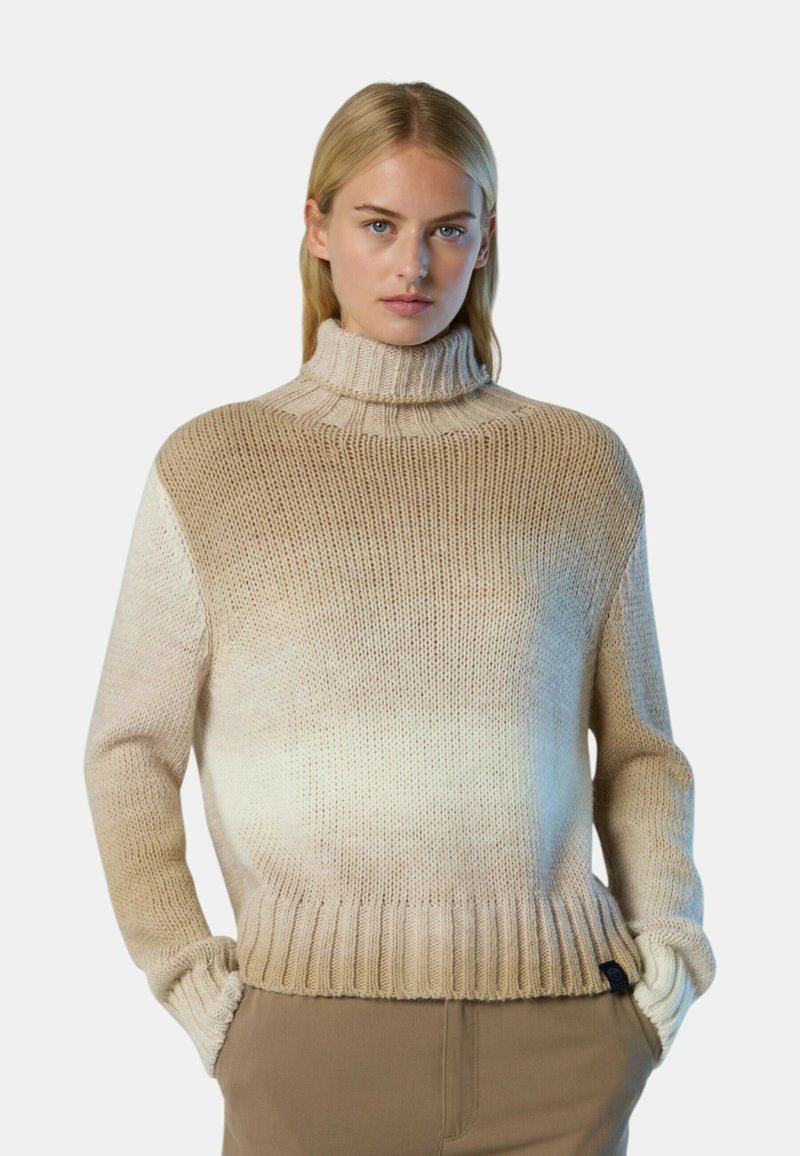 Chunky Strick-Turtleneck-Pullover in einem abgestuften Beigeton, mit geripptem Saum und Bündchen. Strukturiertes Gewebe mit lockerer Passform und seitlichen Taschen.