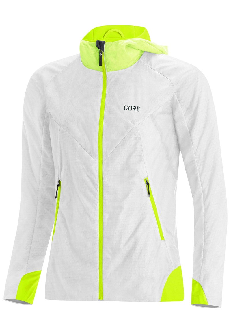 Chaqueta ligera blanca con acentos en amarillo neón, con cierre de cremallera, dos bolsillos laterales y capucha. Tejido texturizado para mayor transpirabilidad.