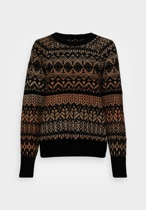Pull en tricot avec un motif géométrique complexe en noir, beige et rouille. Les poignets et le col côtelés noirs ajoutent de la texture et du contraste.