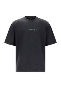 Sort oversized T-shirt lavet af bomuld, med rund hals, korte ærmer og en slidt kant. Lille grå logo på fronten.