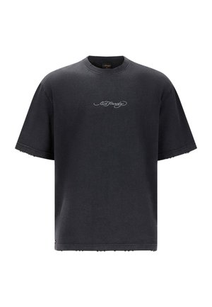 T-shirt oversize nera in cotone, con colletto rotondo, maniche corte e orlo sfilacciato. Piccolo logo grigio sul davanti.