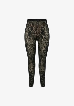 Leggings in pizzo nero con intricati motivi floreali e geometrici, una consistenza liscia e una vita elastica per un look aderente.