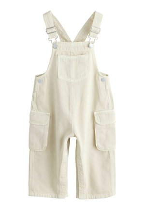 Beige cotton overalls with adjustable shoulder straps, two side pockets, and a front pocket. Smooth texture with reinforced stitching.