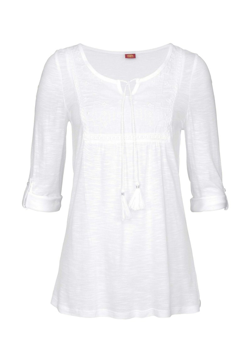 White, long-sleeve blouse with a round neckline, lace detailing at the chest, and adjustable tie with tassels. Lightweight, textured fabric.