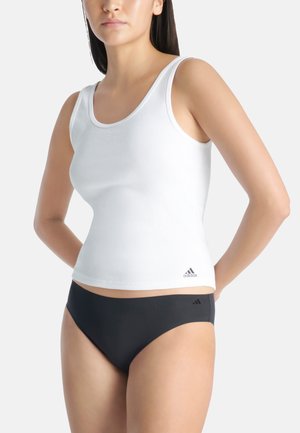 White sleeveless tank top with a ribbed texture and rounded neckline. Black logo at the hem. Paired with black high-waisted underwear.