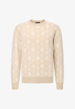 Kreemi värvi sviiter, millel on diamantmuster, valmistatud pehmest materjalist. Omab ümmargust kaelust ja pikki varrukaid ribatud mansettidega.