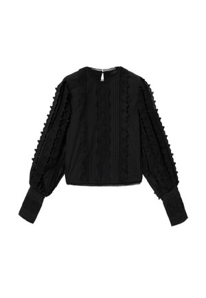 Blouse noire avec détails en dentelle texturée, manches volumineuses, encolure ronde et motifs complexes sur le devant et les poignets.