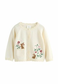 Kreemjas beebitekk nööpidega, tikitud pruuniq jänesed, roosad ja punased lilled ning väike esimine tasku vasakul küljel.