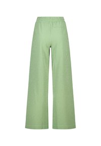 Pantalons larges en vichy vert avec une taille élastique. Fabriqués dans un tissu léger, avec un motif à carreaux sur l'ensemble.