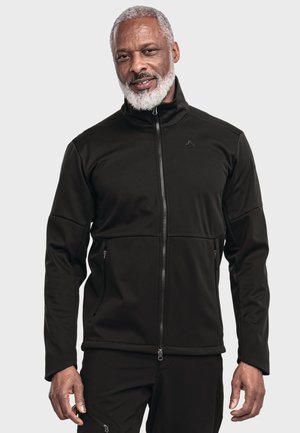 Schwarze Zip-Jacke aus weichem Stoff mit hohem Kragen, ausgestattet mit zwei seitlichen Taschen und einem dezenten Logo auf der Brust. Glatte Textur, taillierter Schnitt.