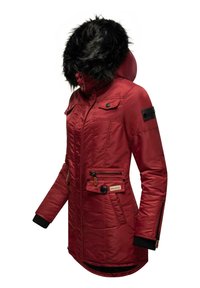 Red insulated jacket with a faux fur hood, zippered front pockets, ribbed cuffs, and a logo patch on the sleeve. Smooth, shiny finish.