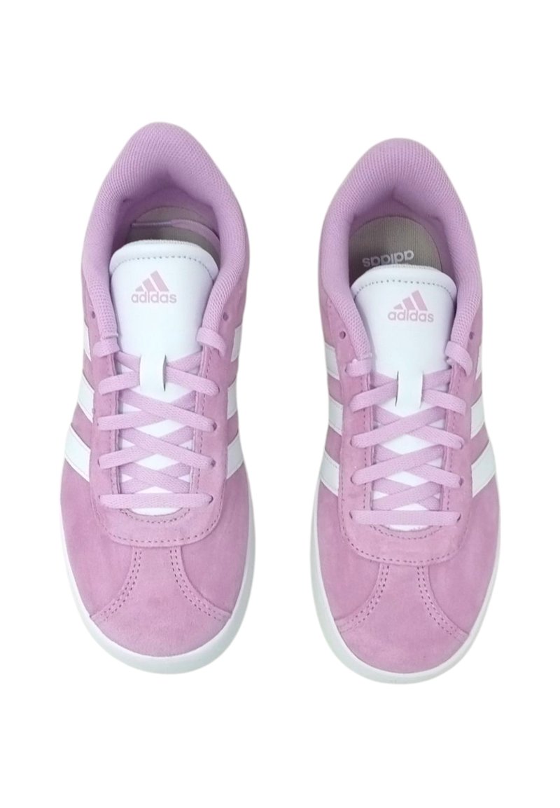 Pink suede sneakers with white stripes, rounded toe, lace-up design, padded collar, and contrasting white rubber sole.