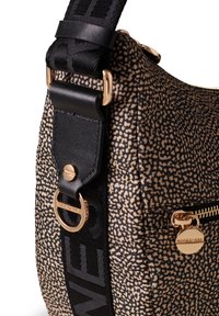 Textured black-and-beige patterned shoulder bag with a synthetic exterior, gold-tone hardware, and a prominent black strap with logo.