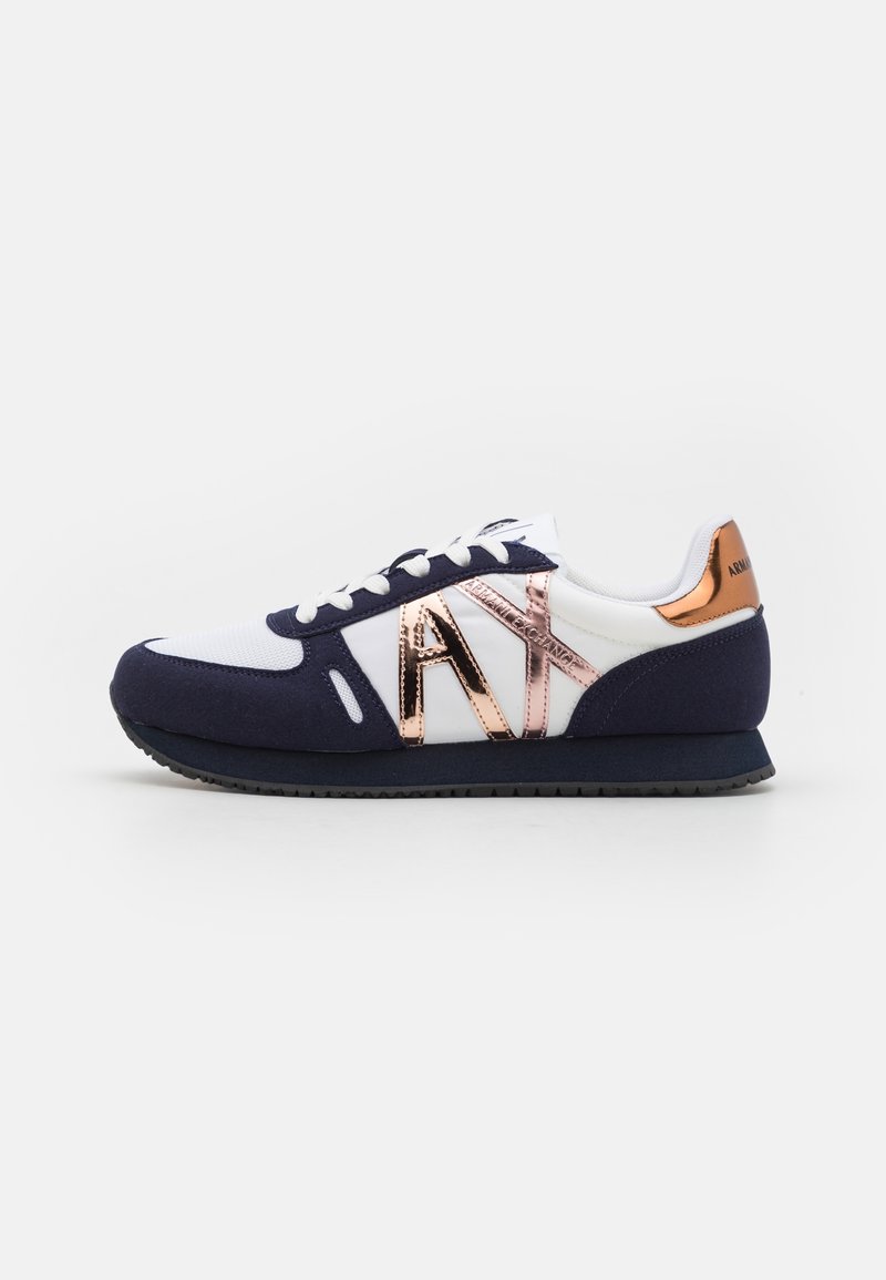 Navy and white sneaker featuring a metallic rose gold accent, fabric upper, rubber sole, and a lace-up design with logo detail.