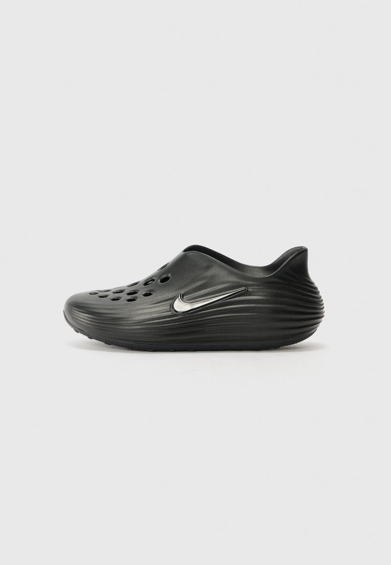 Black slip-on clogs with smooth, textured surface, multiple ventilation holes, and a silver Nike logo on the side. Rounded back.