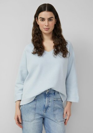 - Bluzka z długim rękawem