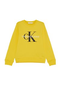 Sudadera amarilla de manga larga con puños y dobladillo acanalados, que presenta un gran "ck" negro y el texto en blanco "CALVIN KLEIN JEANS" centrado en la parte frontal.