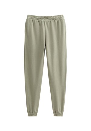 Ljusgröna sweatpants med elastisk midja, tapered ben och mudd. Tillverkade av mjukt tyg med en slät yta.