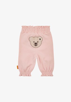 Lichtroze katoenen broek met een gerimpelde tailleband en elastische boorden. Beschikt over een teddybeerapplicatie op de achterzak. Soepele textuur.
