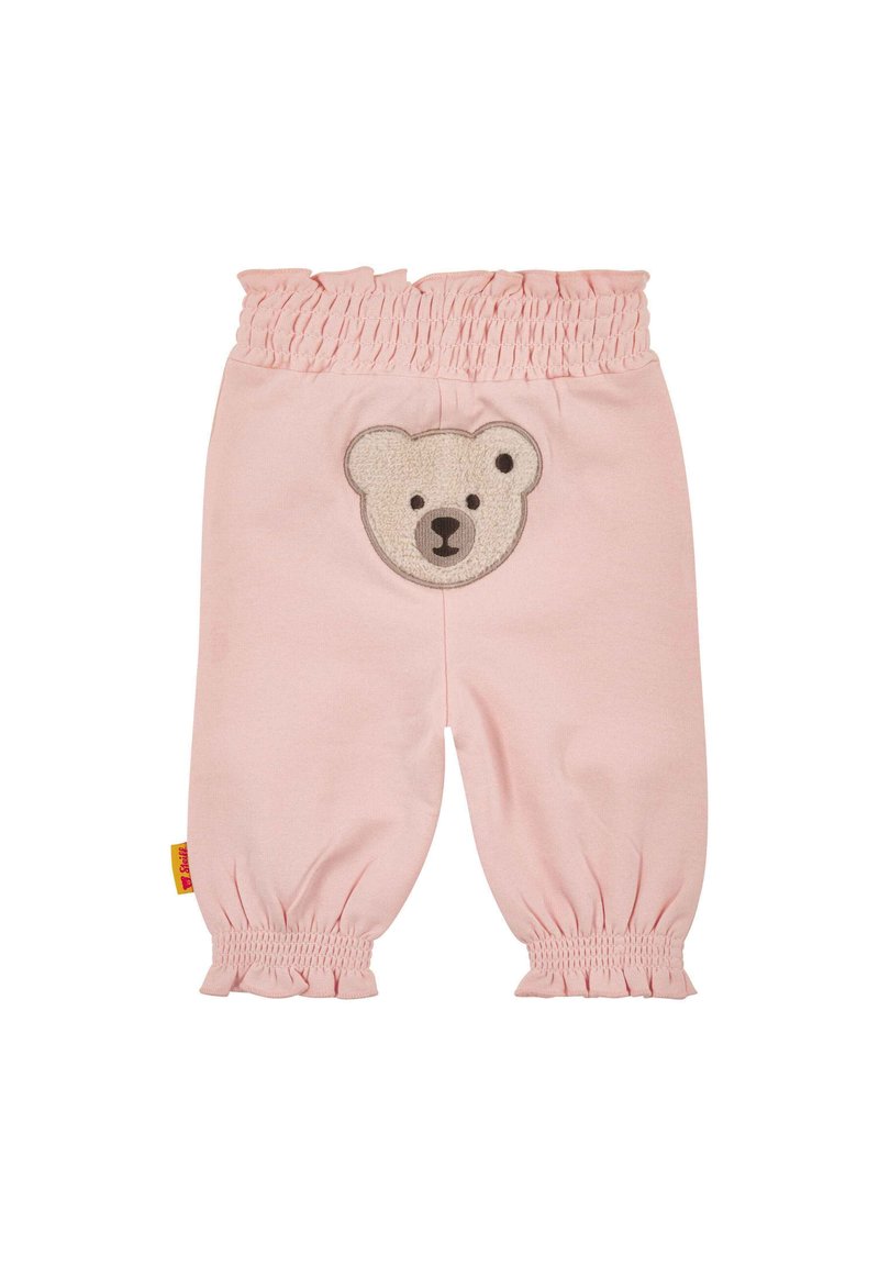Pantaloni di cotone rosa chiaro con vita arricciata e polsini elasticizzati. Presentano un'applicazione di orsetto sulla tasca posteriore. Texture liscia.