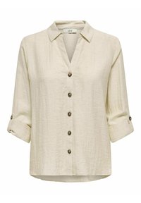 Lichtbeige linnen shirt met een V-hals en knoopsluiting. Heeft opgerolde mouwen en bruine knopen, met een iets losse pasvorm.