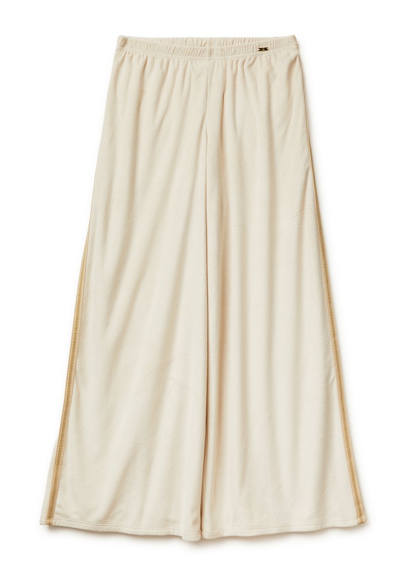 Béžové široké kalhoty z měkkého materiálu s elastickým pasem a jemným bočním švem. Mají volný střih a hladkou texturu.