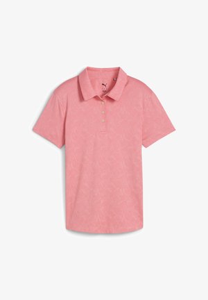 Světle růžové polo tričko s texturovaným květinovým vzorem, s knoflíkovou légou na tři knoflíky a klasickým límečkem. Krátké rukávy, měkká tkanina.
