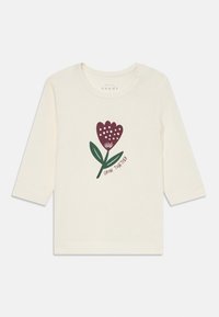 Kremfarget langermet skjorte for småbarn med en burgunder blomst og grønne blader grafikk, og "Grow Together"-tekst under blomsten.
