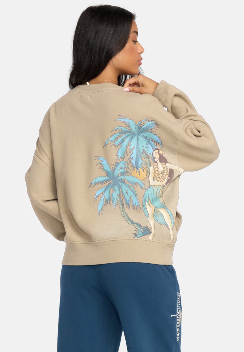 Beżowa bluza z grafiką palm i kobiety na plecach, z niebieskimi i zielonymi akcentami. Luźny krój z prążkowanymi mankietami.
