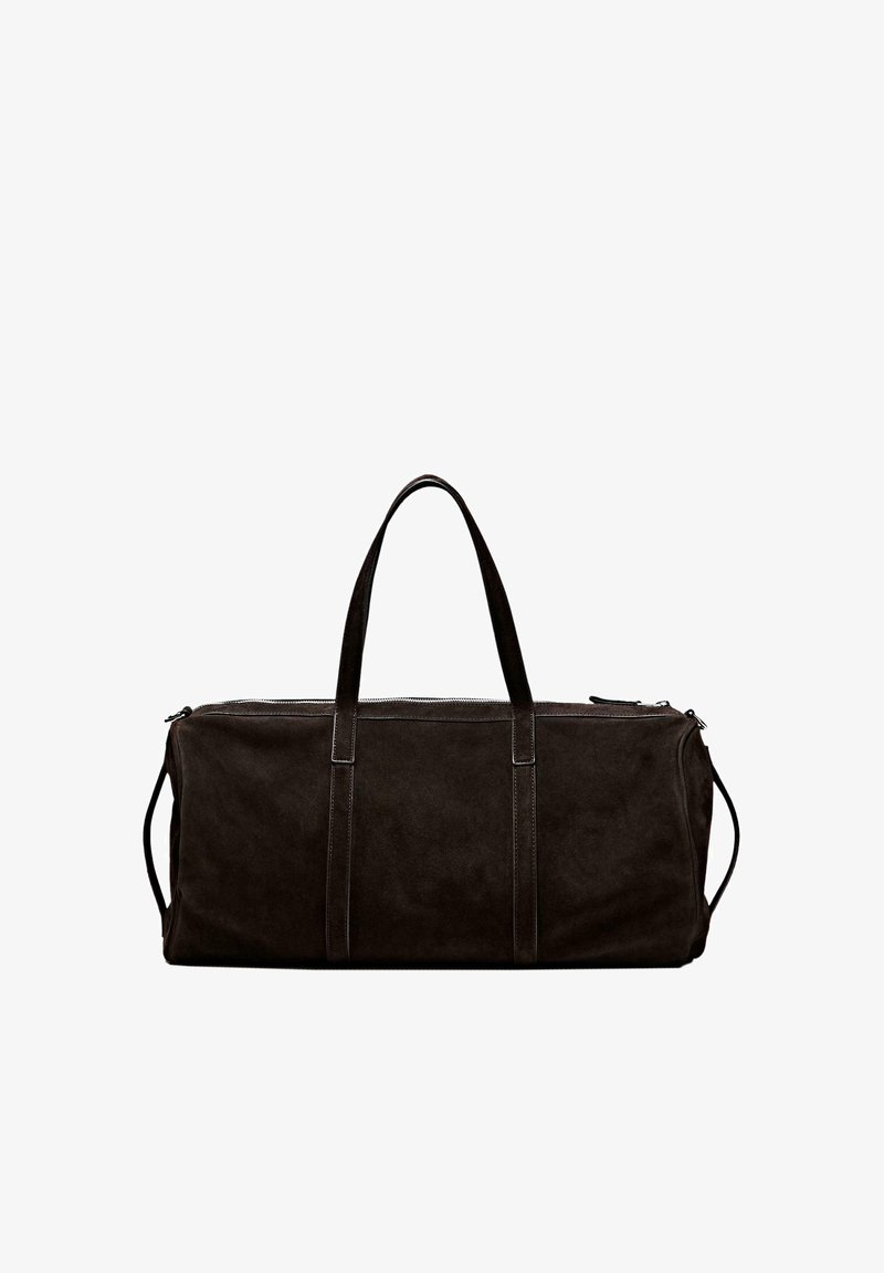 Sac de sport rectangulaire noir avec double poignées supérieures, sangles latérales et fermeture éclair, présenté sur fond blanc.