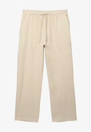 Jasno beżowe, luźne spodnie wykonane z fakturowanej tkaniny. Posiadają elastyczny pasek w talii z regulowanym sznurkiem oraz boczne kieszenie.