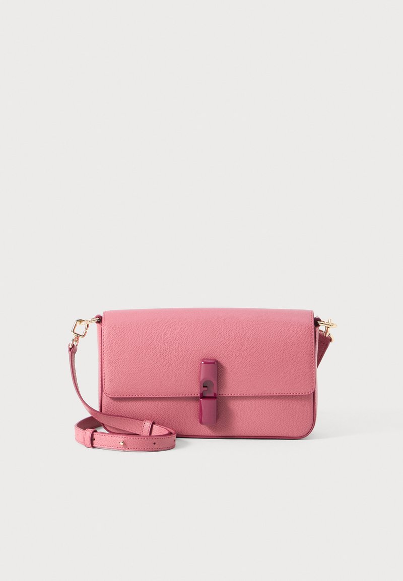 Pink leather flap handbag with a textured finish, featuring a central latch closure and a detachable strap, set against a plain background.