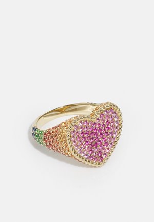 Gold ring featuring a heart-shaped design, adorned with multi-colored gemstones in pink, orange, and green, with a textured band.