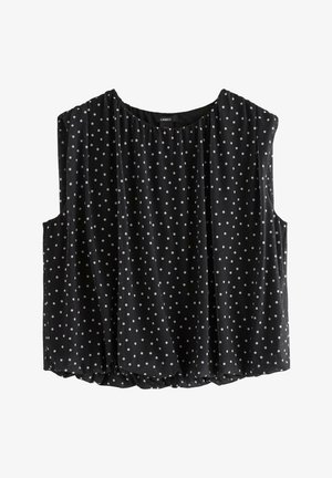 Sort ærmeløs bluse med hvide polkaprikker, rund halsudskæring og løs pasform, mærket Lindex.