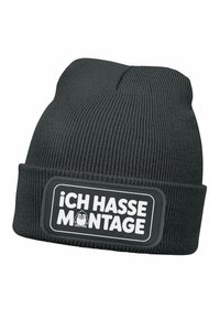 Black knitted beanie with a folded cuff, featuring a rectangular patch that reads "Ich hasse Montage" in white text with a cartoon character.