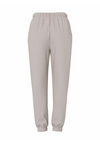 Jasnoszare spodnie dresowe z elastycznym pasem i zwężanymi mankietami. Wykonane z miękkiego materiału, o prostym, gładkim wzornictwie.