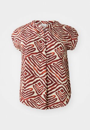 Bluză cu mânecă scurtă în crem, decorată cu modele geometrice zigzag îndrăznețe în nuanțe de roșu și brun. Prezintă un guler tip bandă și închidere cu nasturi în față.