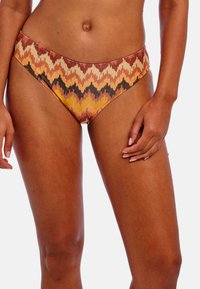 Plavkový spodní díl s vysokým pasem s cik-cak vzorem v oranžové, hnědé a krémové barvě; vyrobeno z elastického materiálu pro pohodlí.