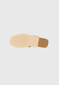 Gold glitter sandal with a smooth beige sole. Features a textured footbed and a flat, wide strap design for support.