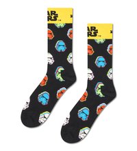 Chaussettes noires ornées de motifs colorés de Stormtrooper et de droïdes, avec un bandeau jaune "Star Wars" en haut. Fabriquées en tissu doux.