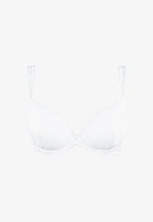 Weißer Spitzen-BH mit gepolsterten, tief ausgeschnittenen Cups und gewellten Kanten. Verstellbare Träger und Hakenverschluss auf der Rückseite. Sanfte Textur über das gesamte Produkt.