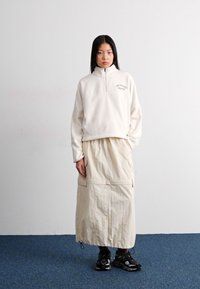 New Balance GRAPHIC POLAR HALF ZIP - Sweat polaire - beige